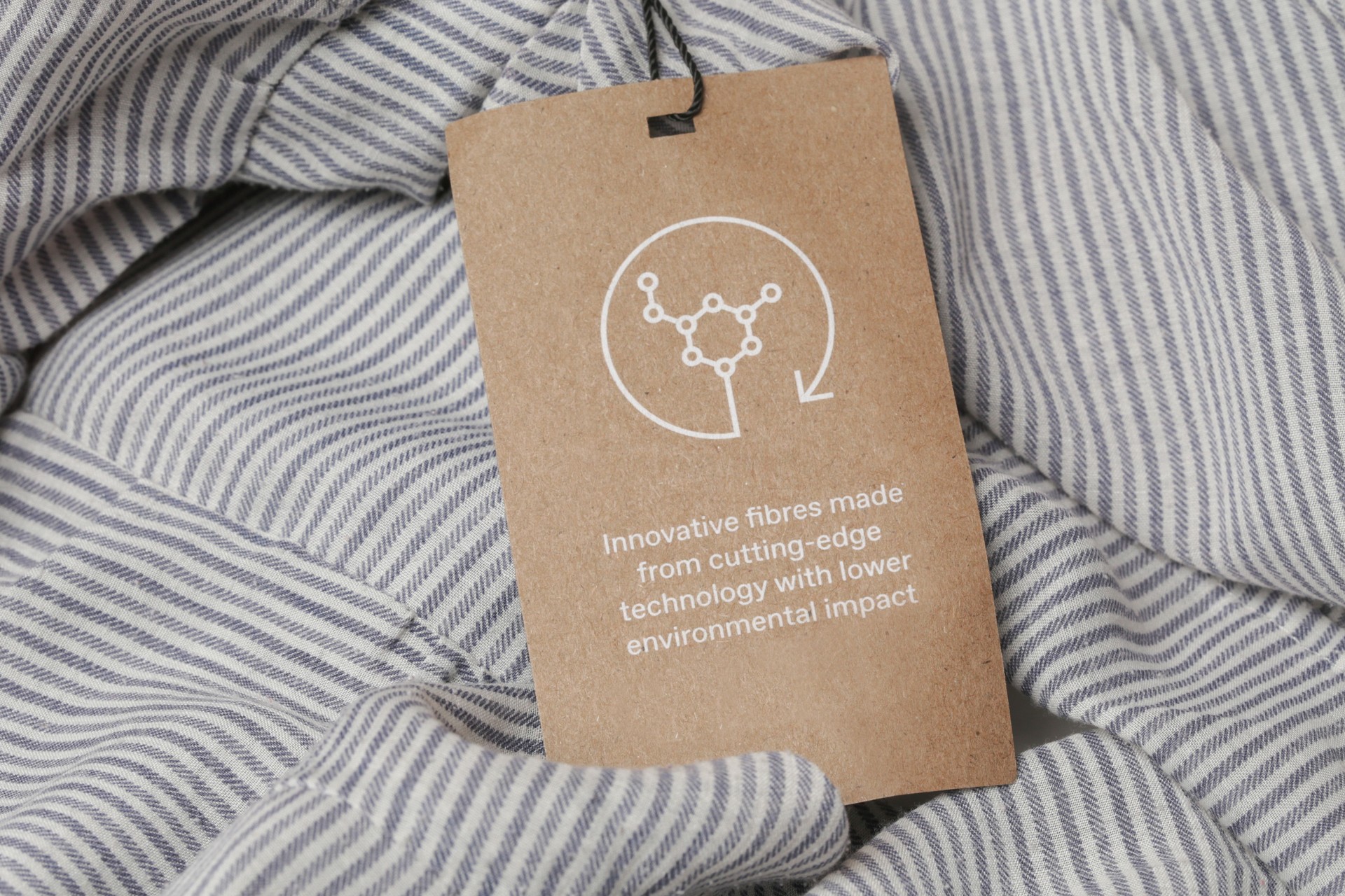 Label on clothes for Cutting-Edge Technologies in Fashion Industry, sustainable fabrics designed to reduce environmental impact. Recycled materials, organic textiles, and biodegradable fibers.