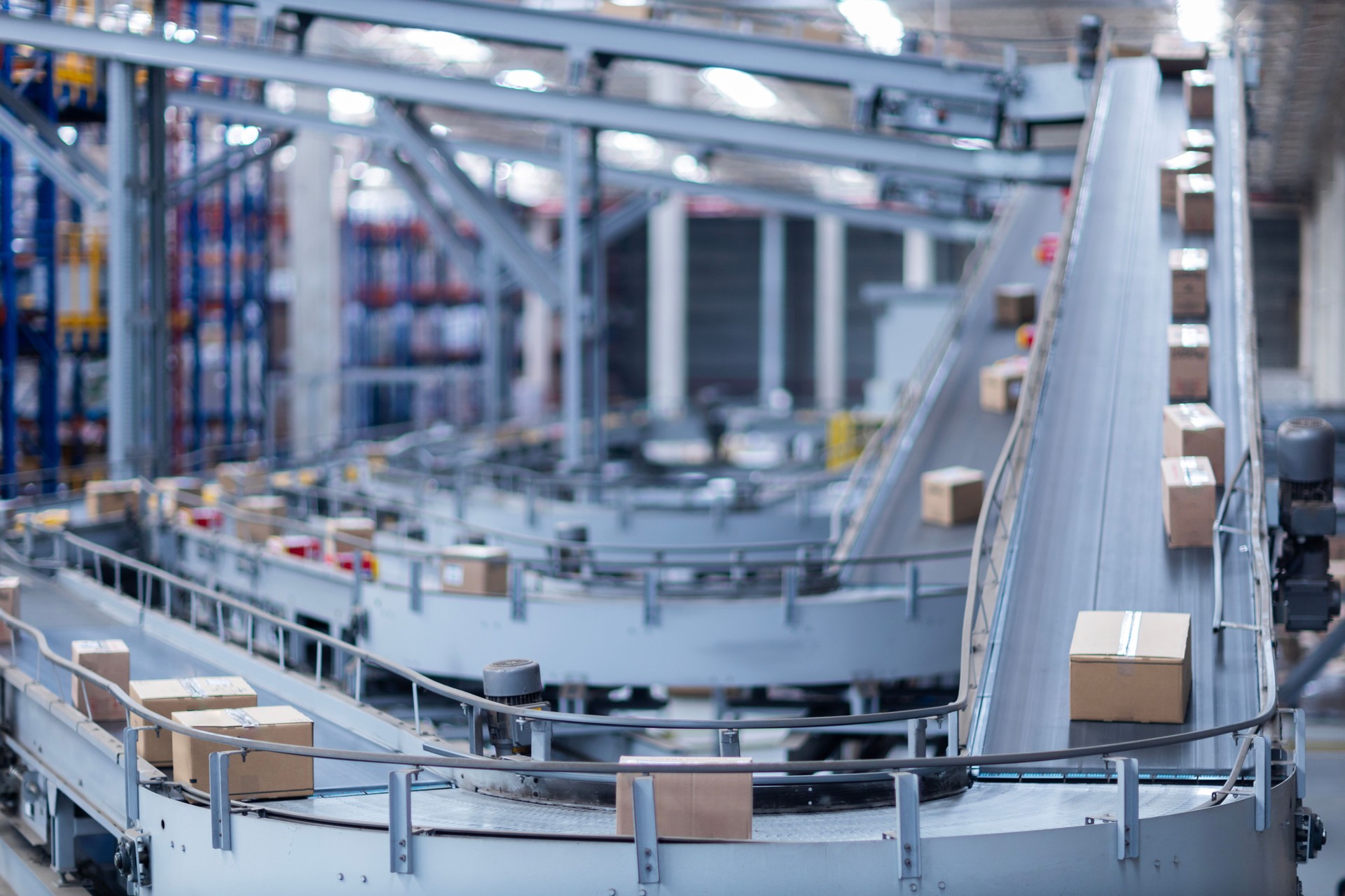 View of modern conveyor belts transporting boxes in a large warehouse ready for delivery. logistics.