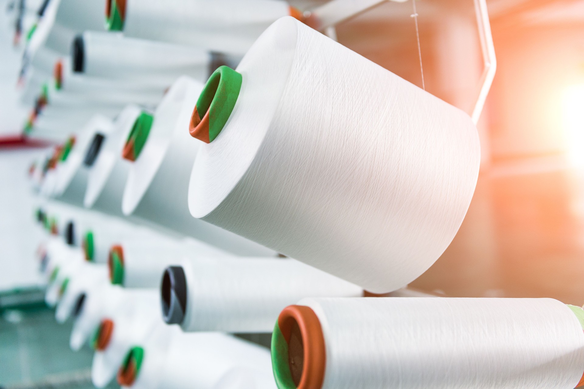 Textile industry - yarn spools on spinning machine